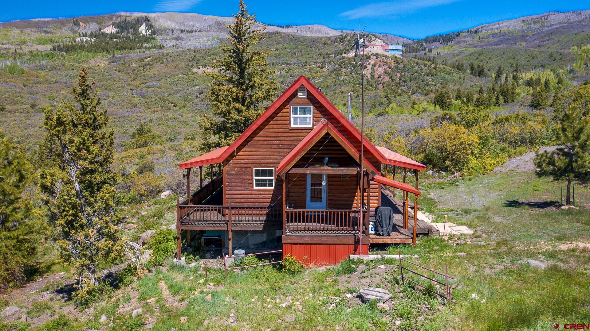 Lot 7 Aspen Hills Road Cedaredge, CO 81413 - Photo 13 of 42 a view of front of house with a yard