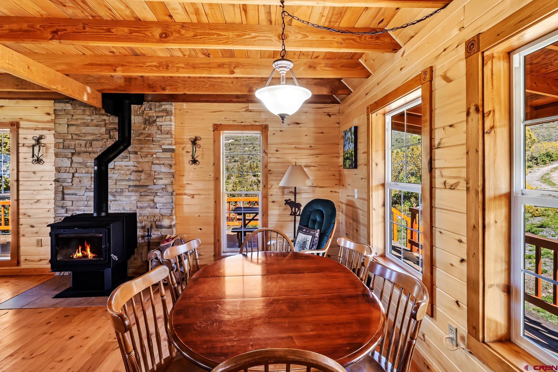 Lot 7 Aspen Hills Road Cedaredge, CO 81413 - Photo 22 of 42 a view of a dining room with furniture window and wooden floor
