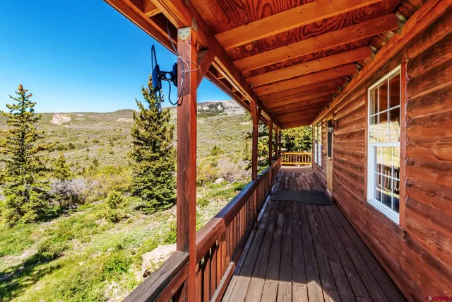a view of balcony with wooden floor