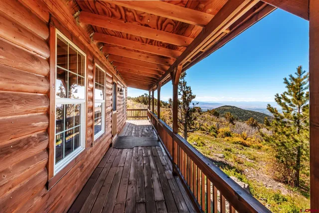 a view of balcony with wooden floor