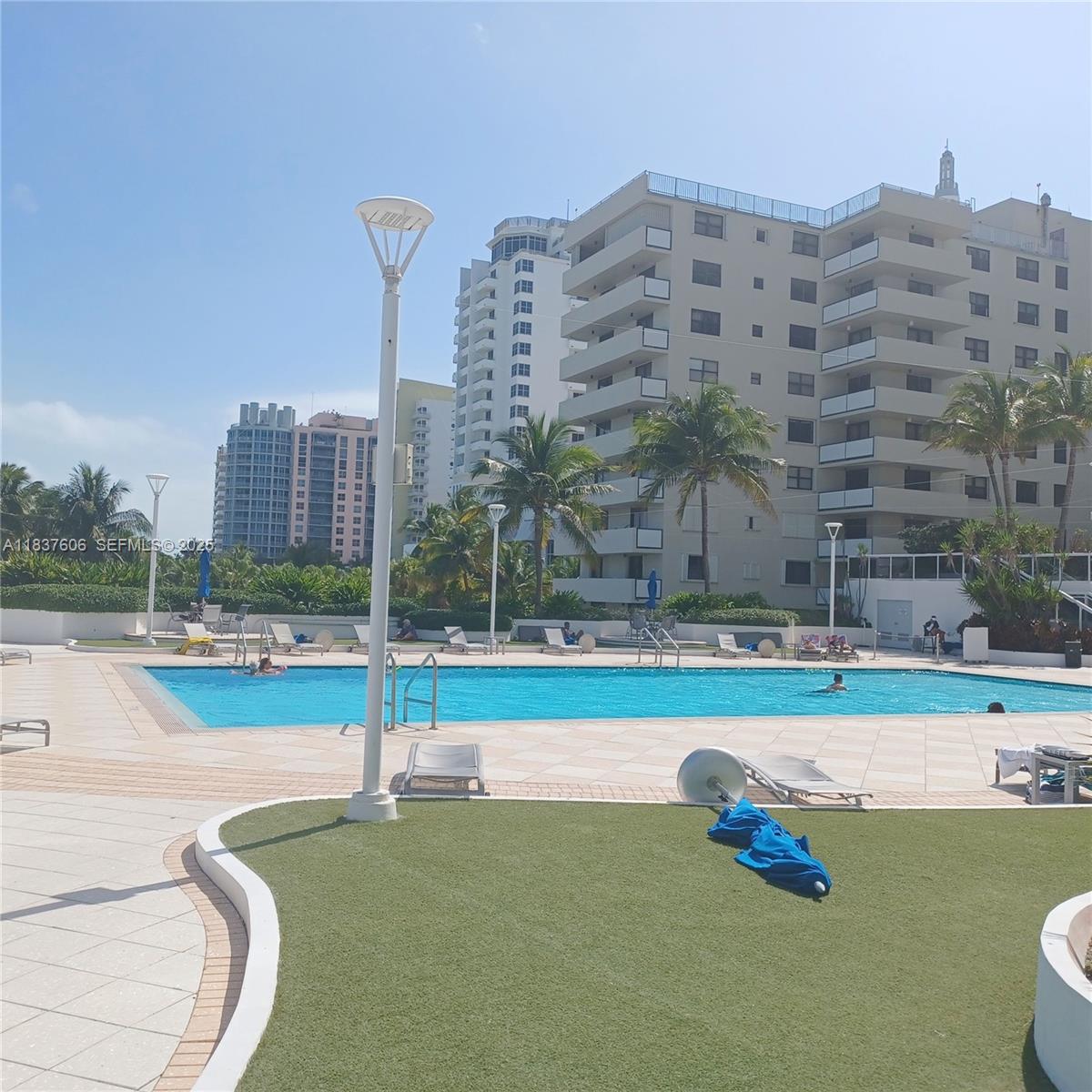 100 Lincoln Road, Unit 1206 Miami Beach, FL 33139 - Photo 3 of 18 a view of a swimming pool with a yard