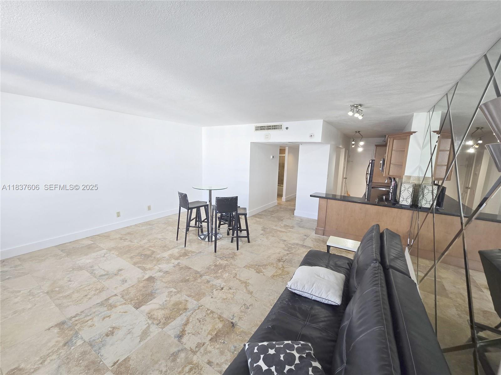 100 Lincoln Road, Unit 1206 Miami Beach, FL 33139 - Photo 8 of 18 a view of a dining room with furniture