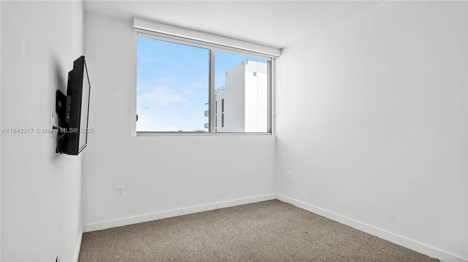 1600 Southwest 1st Avenue, Unit 1104 Miami, FL 33129 - Photo 15 of 22 an empty room with windows