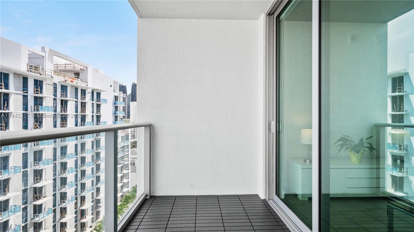 1600 Southwest 1st Avenue, Unit 1104 Miami, FL 33129 - Photo 17 of 22 a view of wooden balcony