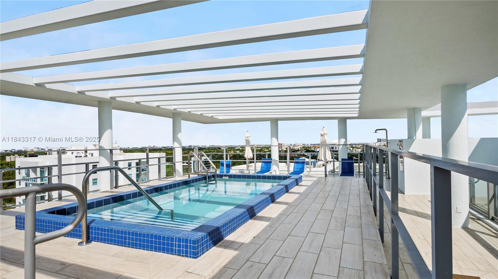 1600 Southwest 1st Avenue, Unit 1104 Miami, FL 33129 - Photo 21 of 22 a living room with lots of furniture and a table