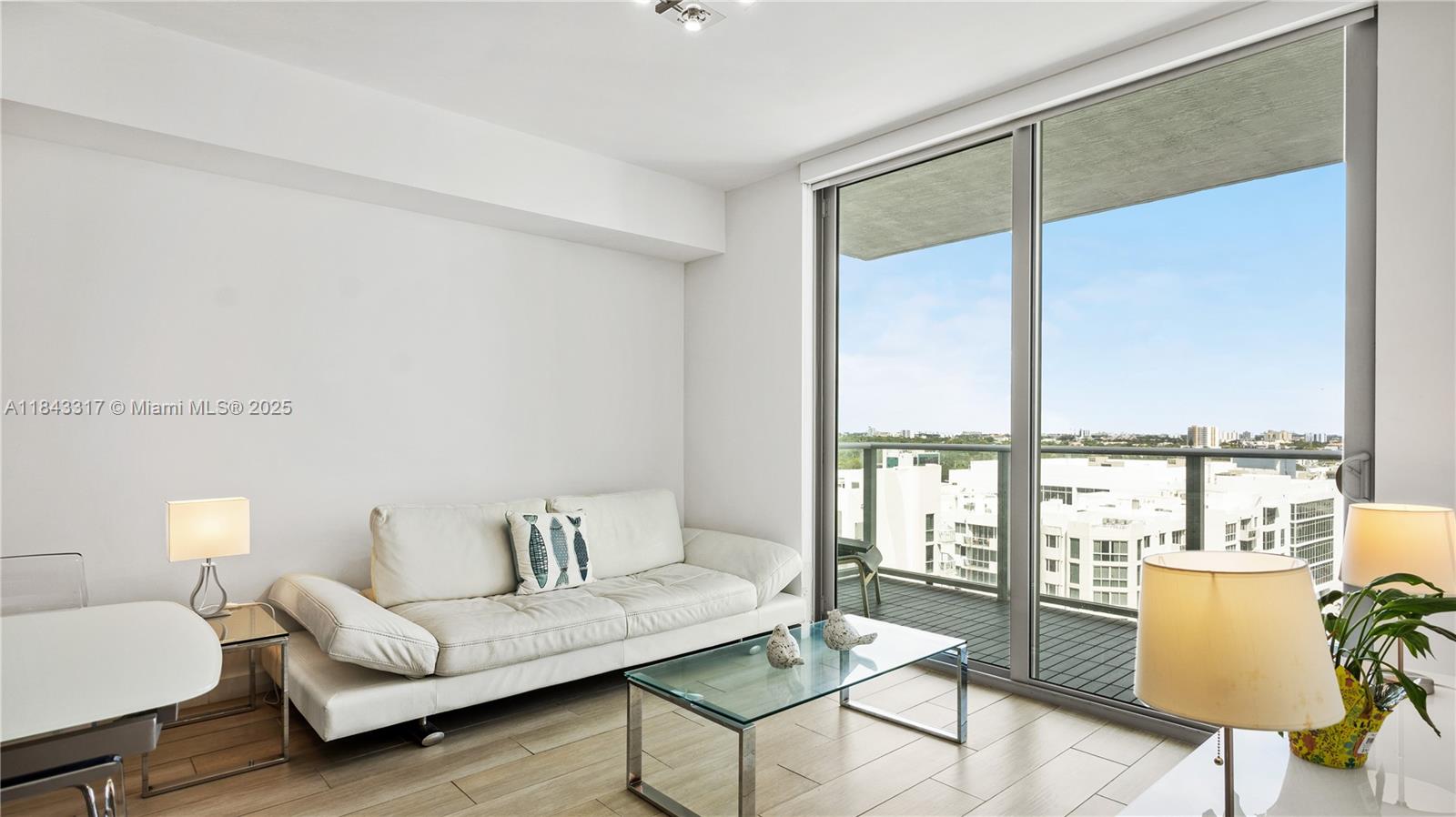 1600 Southwest 1st Avenue, Unit 1104 Miami, FL 33129 - Photo 8 of 22 a living room with furniture and a large window