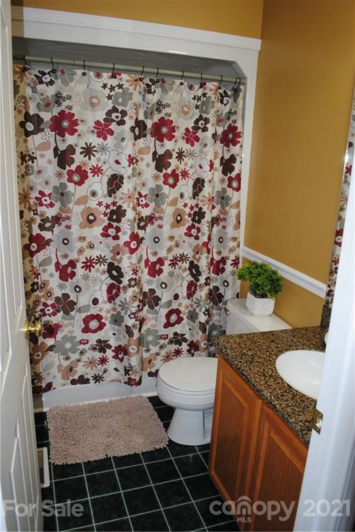 290 Stone Road Salisbury, NC 28146 - Photo 22 of 47 a bathroom with a granite countertop sink and a toilet