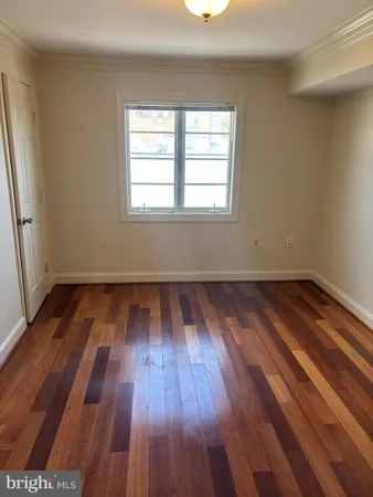 a bathroom with a toilet a sink and a mirror