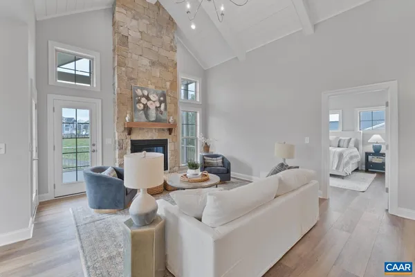 a living room with furniture and a table