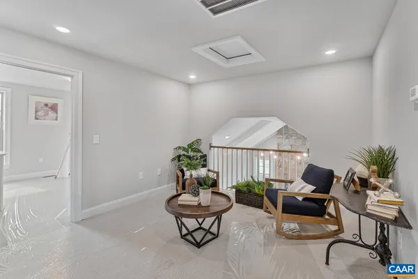 a bedroom with a bed and a lamp