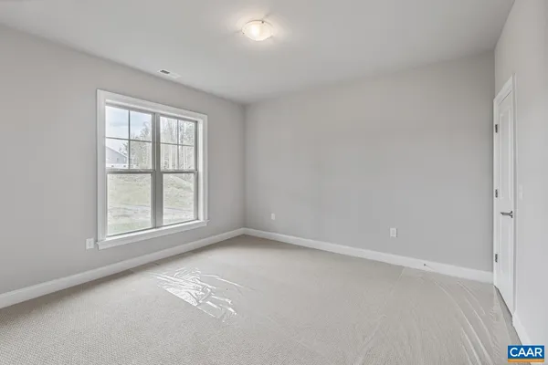 a view of a room with wooden walls