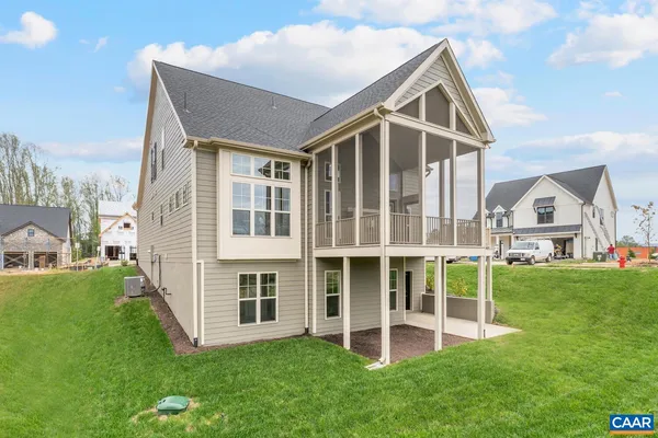 a view of house with yard