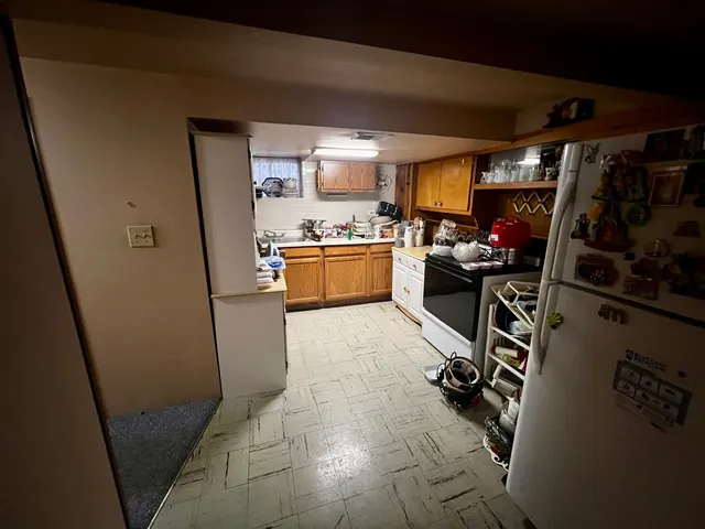 a kitchen with a sink appliances and cabinets