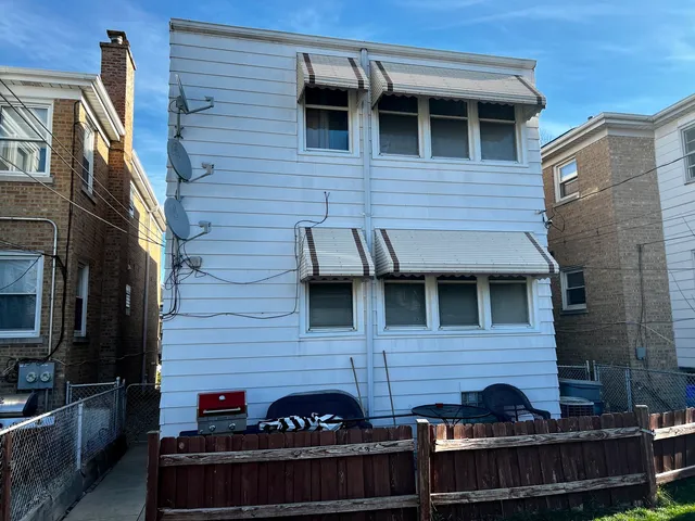 a view of house with outdoor seating