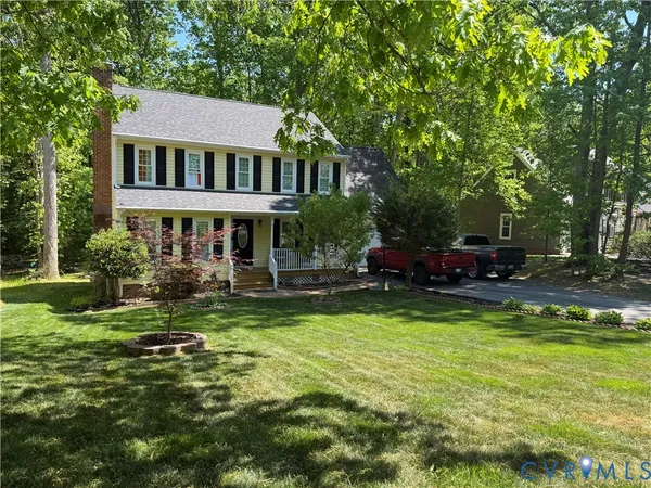 a view of a house with swimming pool and sitting area
