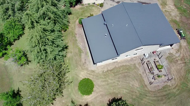 an aerial view of mountain with yard