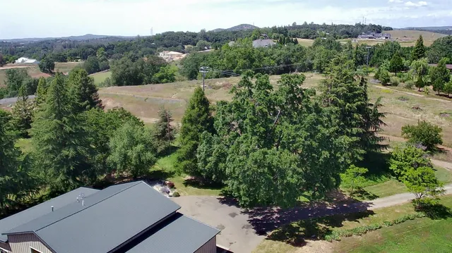 an aerial view of a house with mountain view