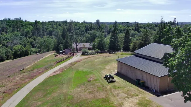 a view of a big yard with lots of green space