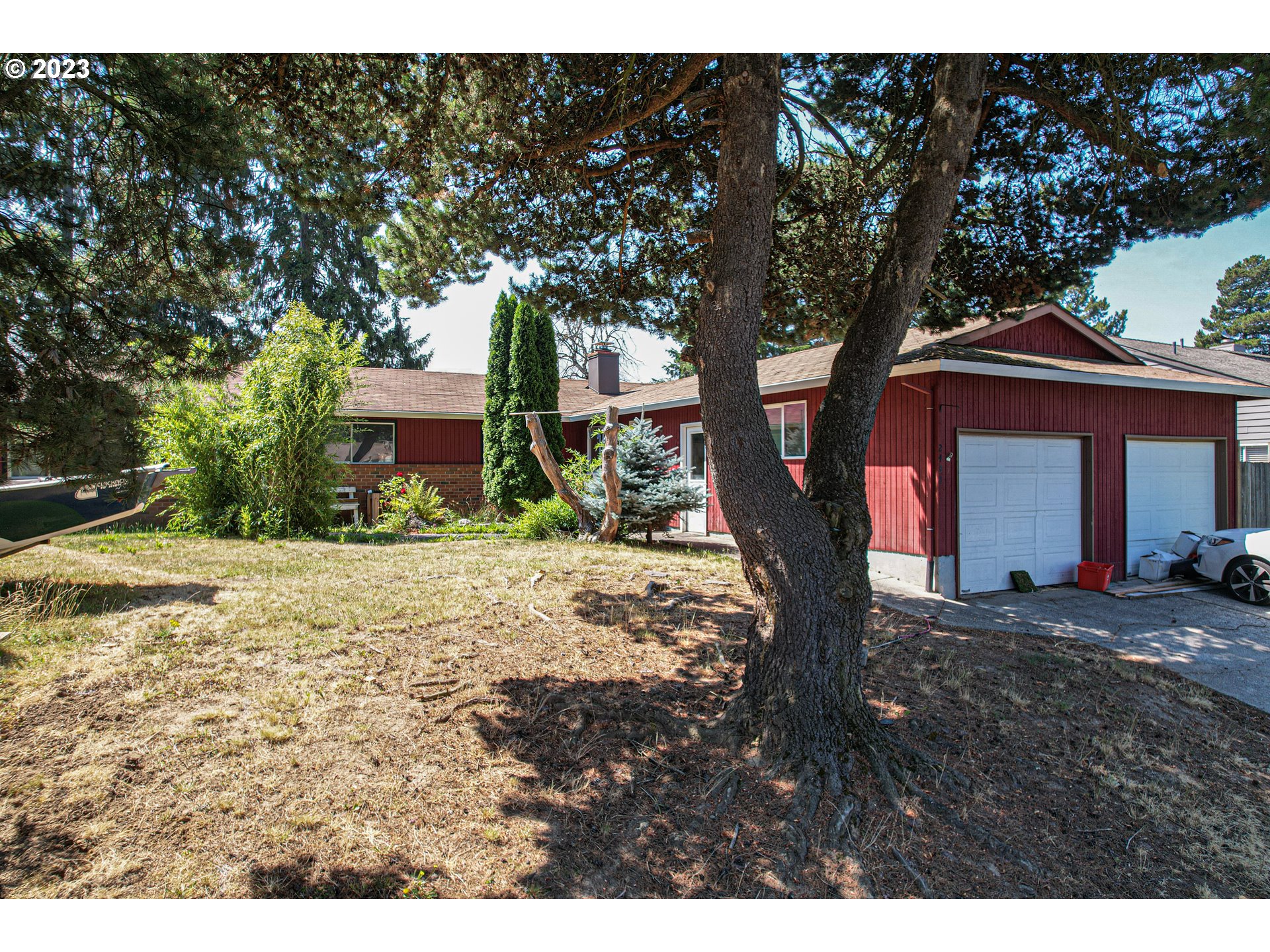 2430 Southeast 9th Court Gresham, OR 97080 - Photo 1 of 4 a front view of a house with a yard and garage