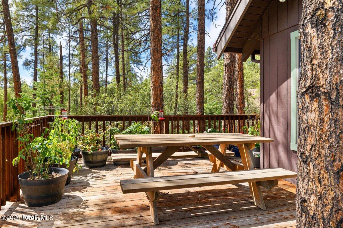 5588 Mountain View Prescott, AZ 86305 - Photo 17 of 45 a view of a balcony with chairs and wooden fence