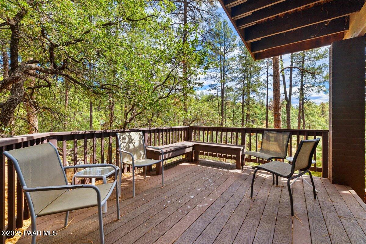 5588 Mountain View Prescott, AZ 86305 - Photo 32 of 45 a view of a balcony with chairs and wooden floor