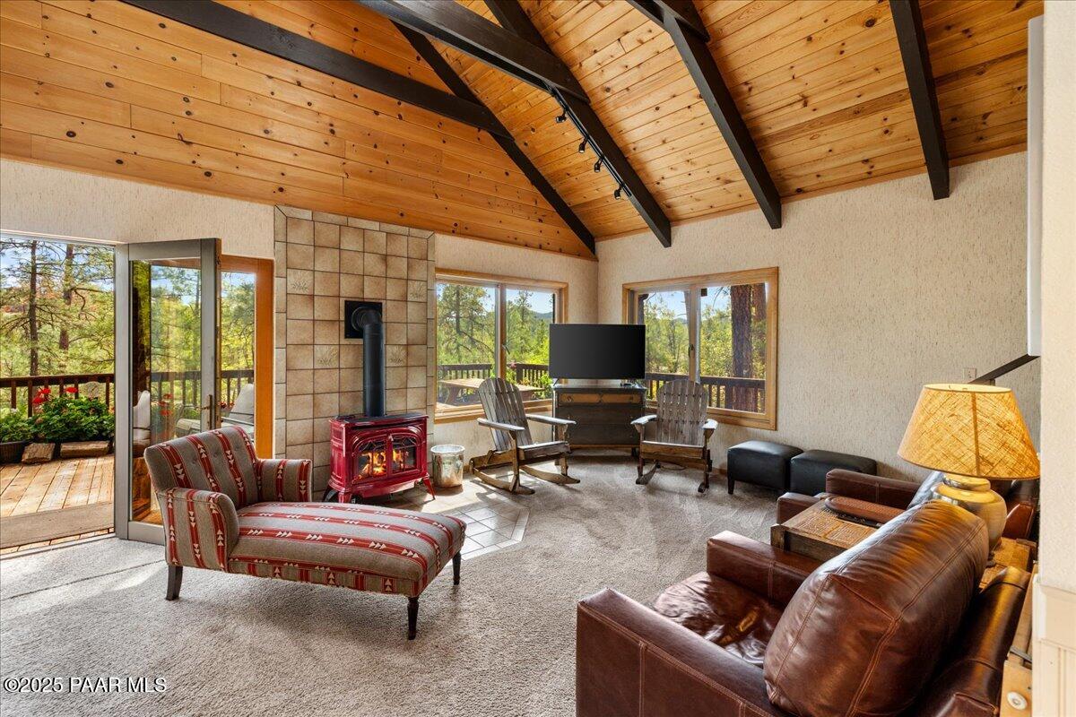 5588 Mountain View Prescott, AZ 86305 - Photo 37 of 45 a living room with furniture a flat screen tv and a large window