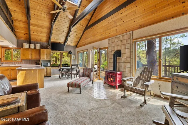 a bedroom with furniture and large windows