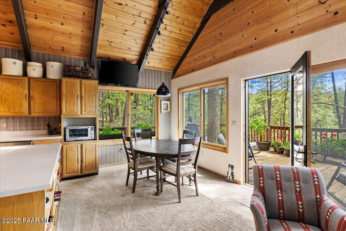 5588 Mountain View Prescott, AZ 86305 - Photo 6 of 45 a dining room with furniture large windows and a rug
