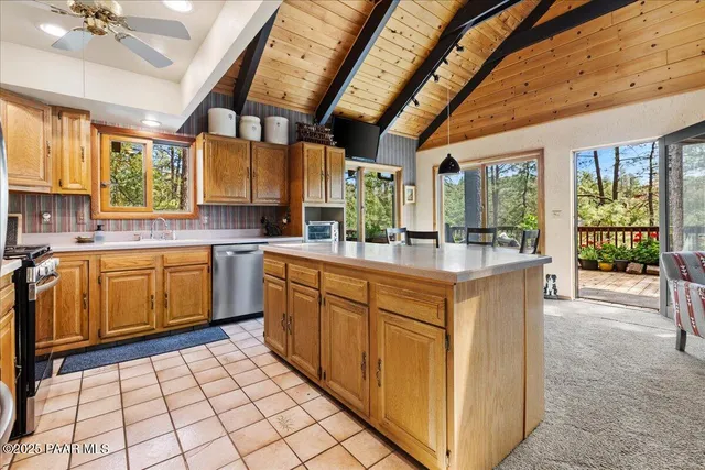 a kitchen with sink cabinets and window