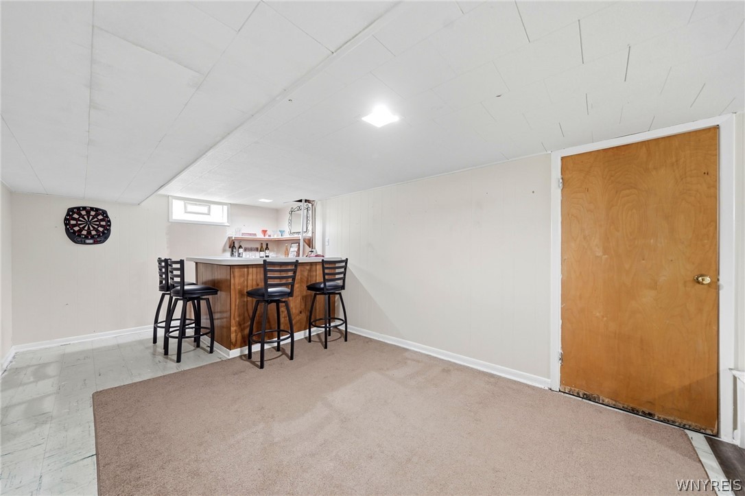 212 Treadwell Road Tonawanda, NY 14150 - Photo 22 of 39 Basement with bar and bar stools!