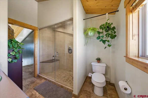 a bedroom with a bed and a window in it