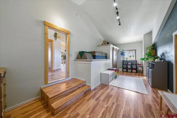 a bedroom with bed and a window