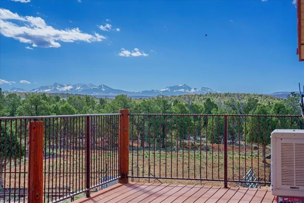 a view of dirt yard with a tree