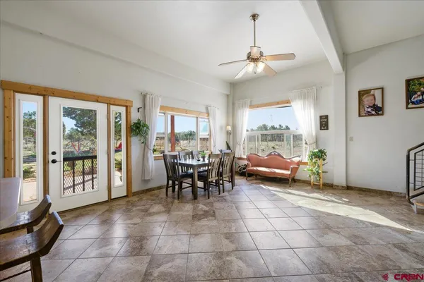 a view of a livingroom with furniture and windows