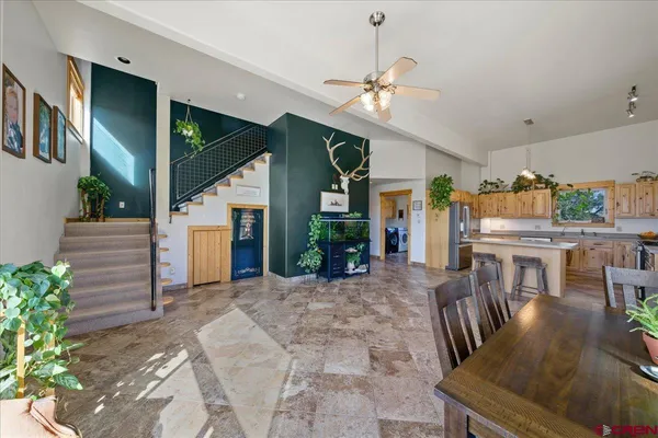 a view of a livingroom with furniture window and wooden floor