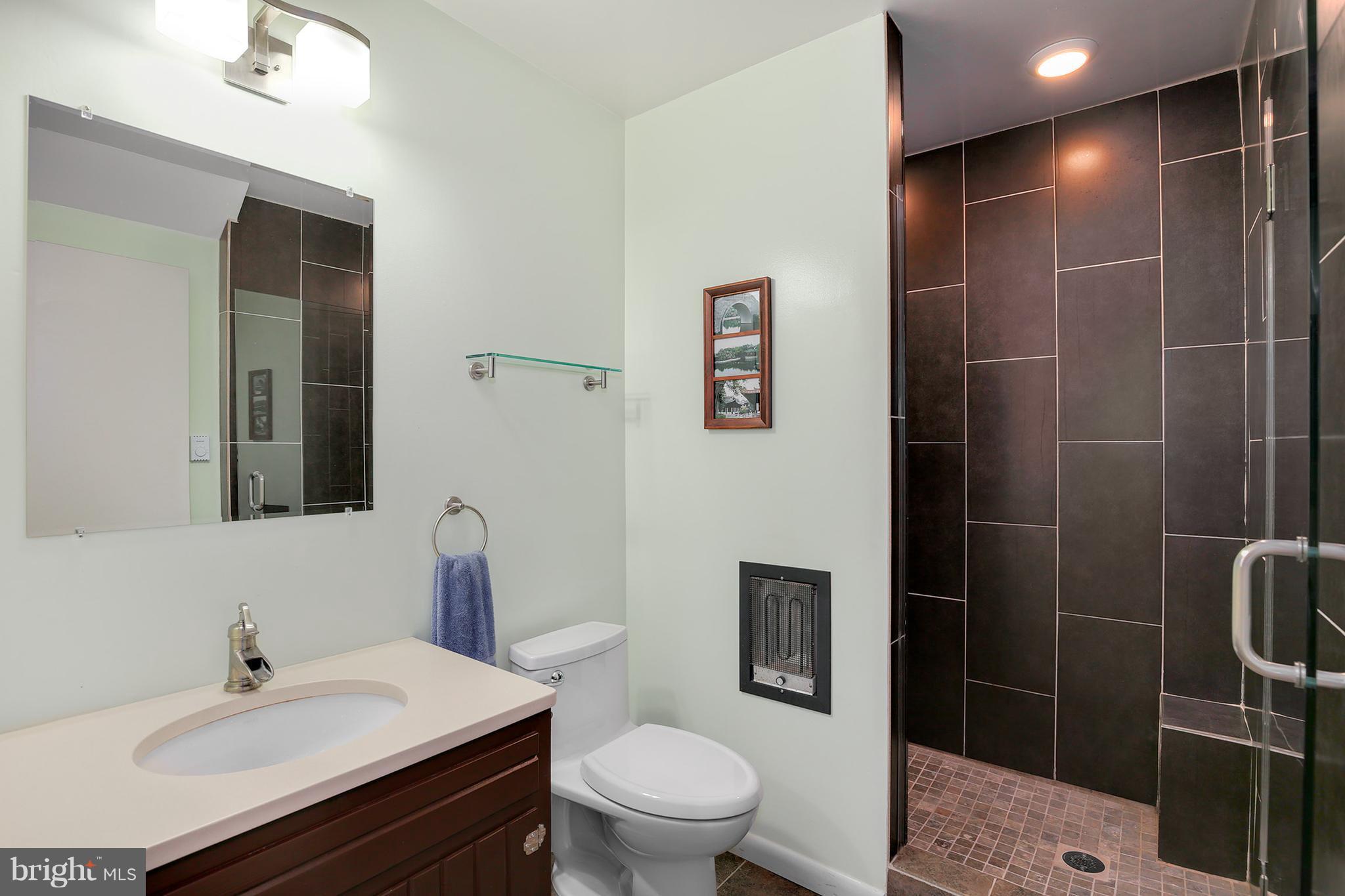 9116 Gue Road Damascus, MD 20872 - Photo 22 of 30 a bathroom with a sink toilet and shower