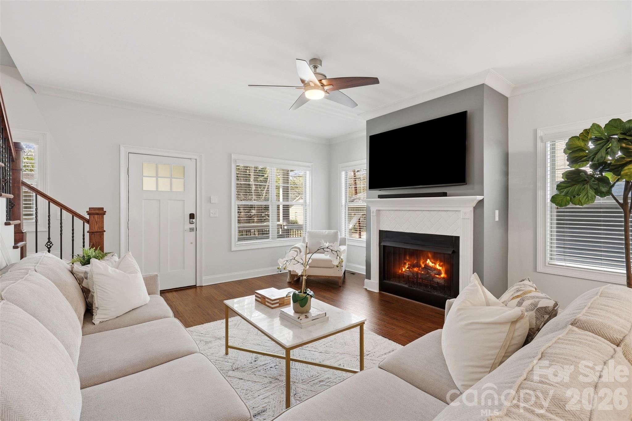 1732 Parson Street Charlotte, NC 28205 - Photo 5 of 33 a living room with furniture a fireplace and a flat screen tv