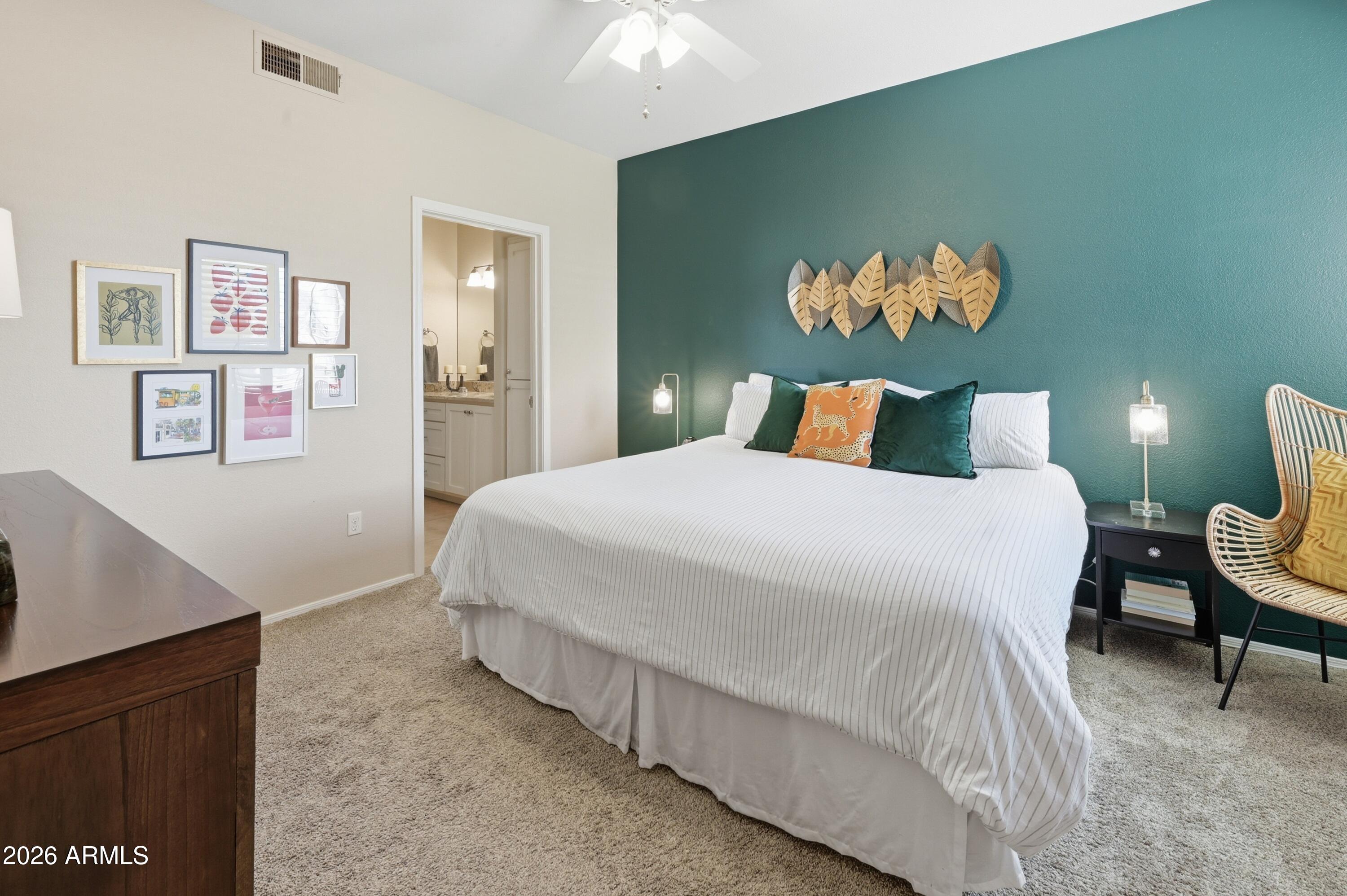 5303 North 7th Street, Unit 220 Phoenix, AZ 85014 - Photo 3 of 33 a bedroom with a bed and painting on the wall