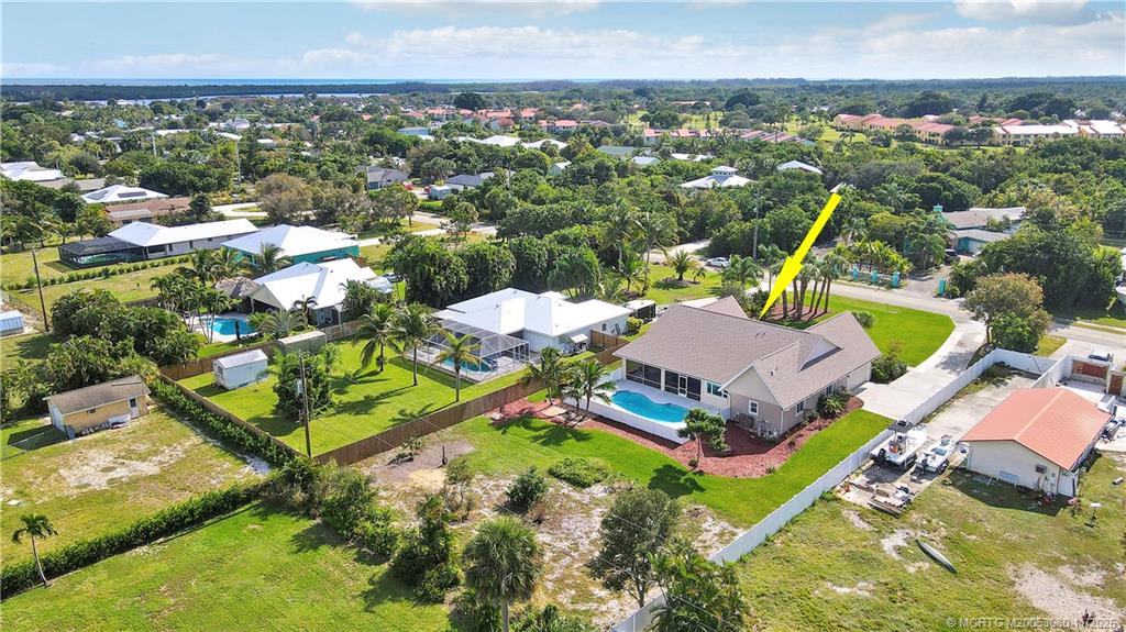 5439 Southeast Horseshoe Point Road Stuart, FL 34997 - Photo 12 of 52 an aerial view of a house with a garden