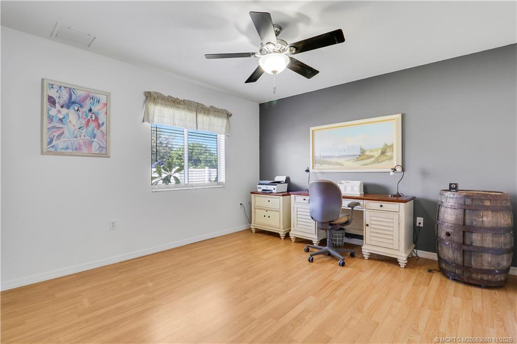 5439 Southeast Horseshoe Point Road Stuart, FL 34997 - Photo 28 of 52 a view of a workspace with furniture and a window