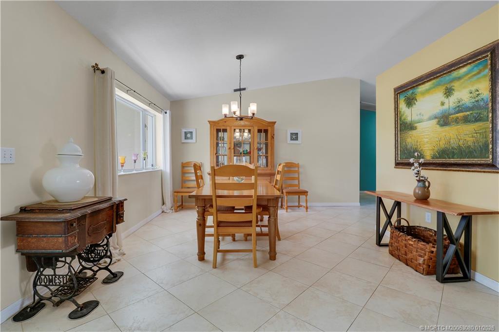 5439 Southeast Horseshoe Point Road Stuart, FL 34997 - Photo 32 of 53 a view of a livingroom with furniture and a chandelier