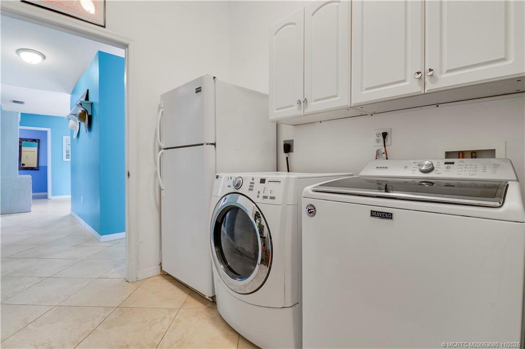 5439 Southeast Horseshoe Point Road Stuart, FL 34997 - Photo 46 of 52 a utility room with dryer and washer