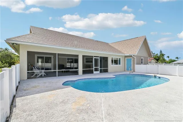 an aerial view of a house with a garden