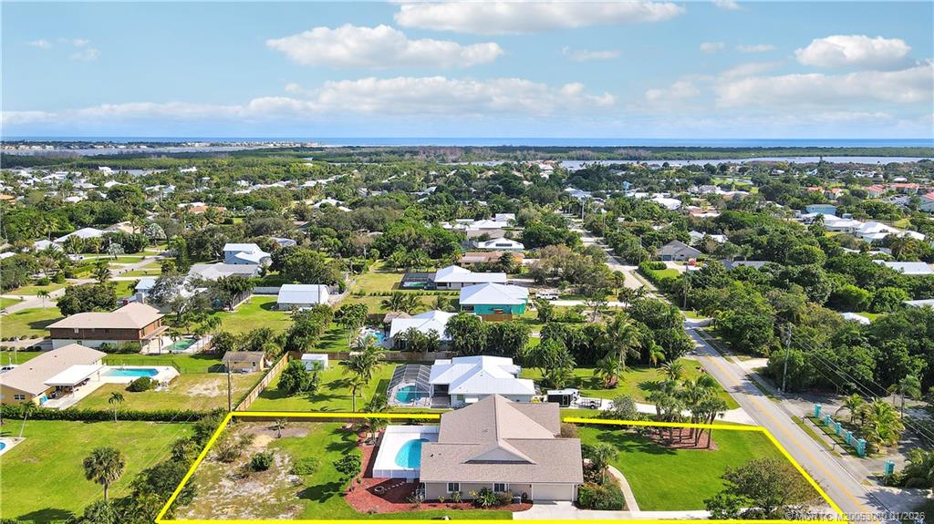 5439 Southeast Horseshoe Point Road Stuart, FL 34997 - Photo 7 of 53 an aerial view of residential houses with outdoor space and trees