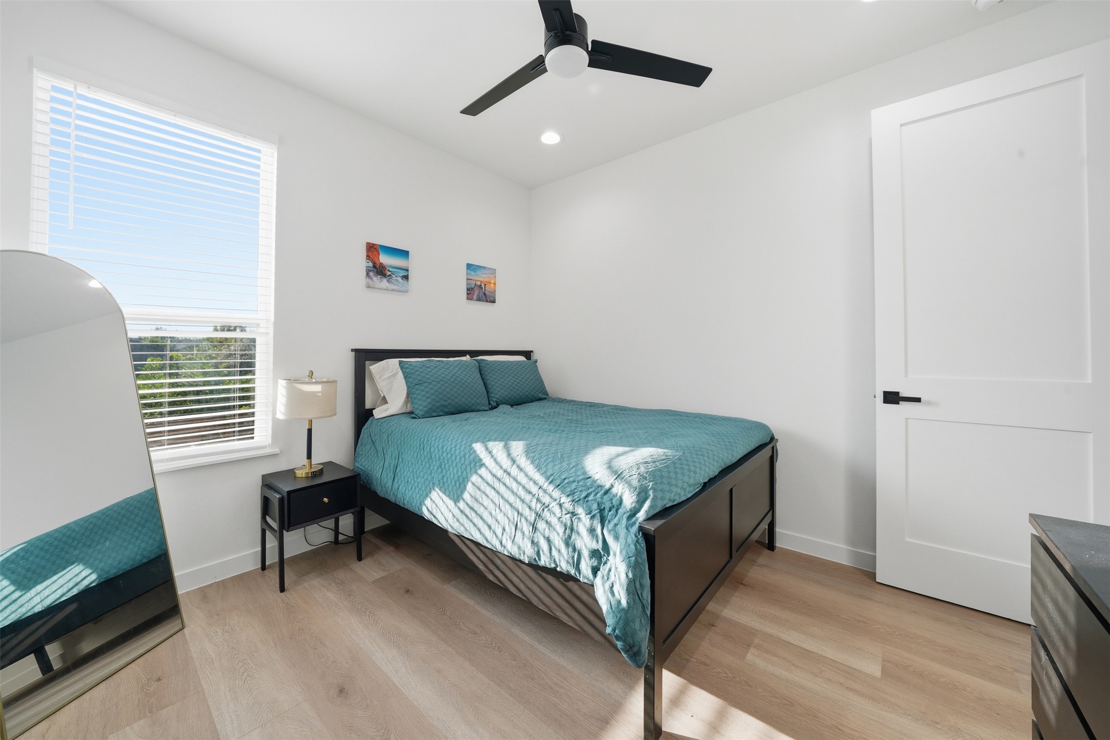 2216 Yellow Jacket Lane, Unit 2 Austin, TX 78741 - Photo 23 of 25 a bedroom with a bed dresser and a window