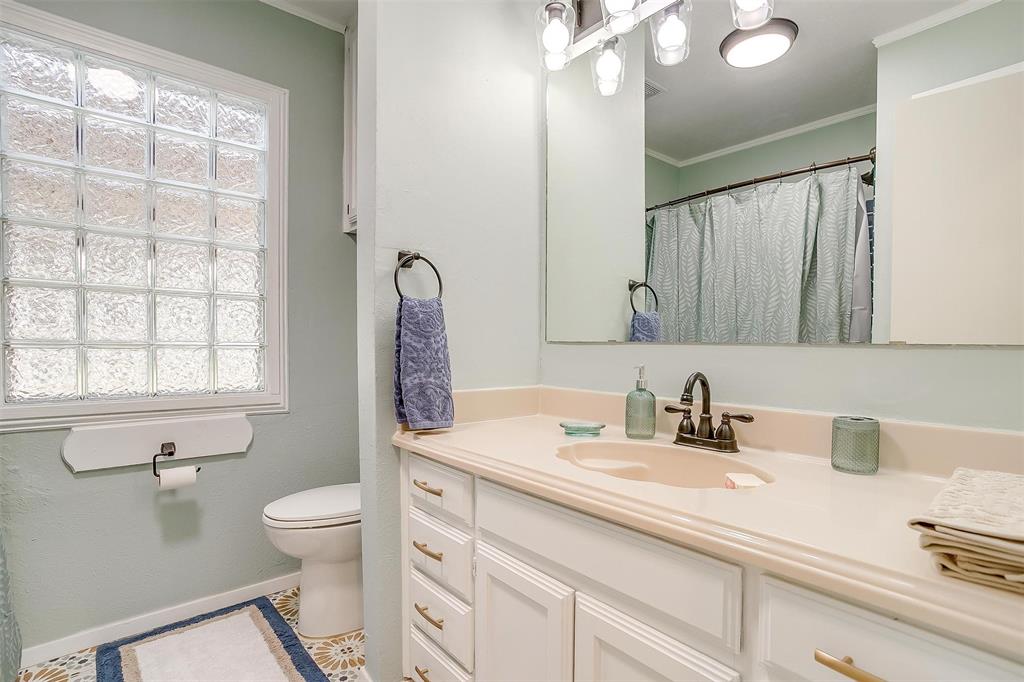 520 Deer Trail Gordon, TX 76453 - Photo 13 of 40 a bathroom with a sink toilet and shower