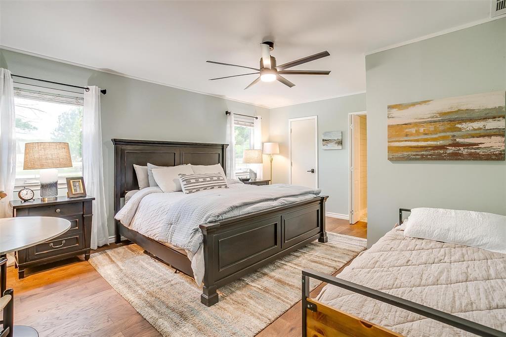 520 Deer Trail Gordon, TX 76453 - Photo 15 of 40 a bedroom with a bed and wooden floor