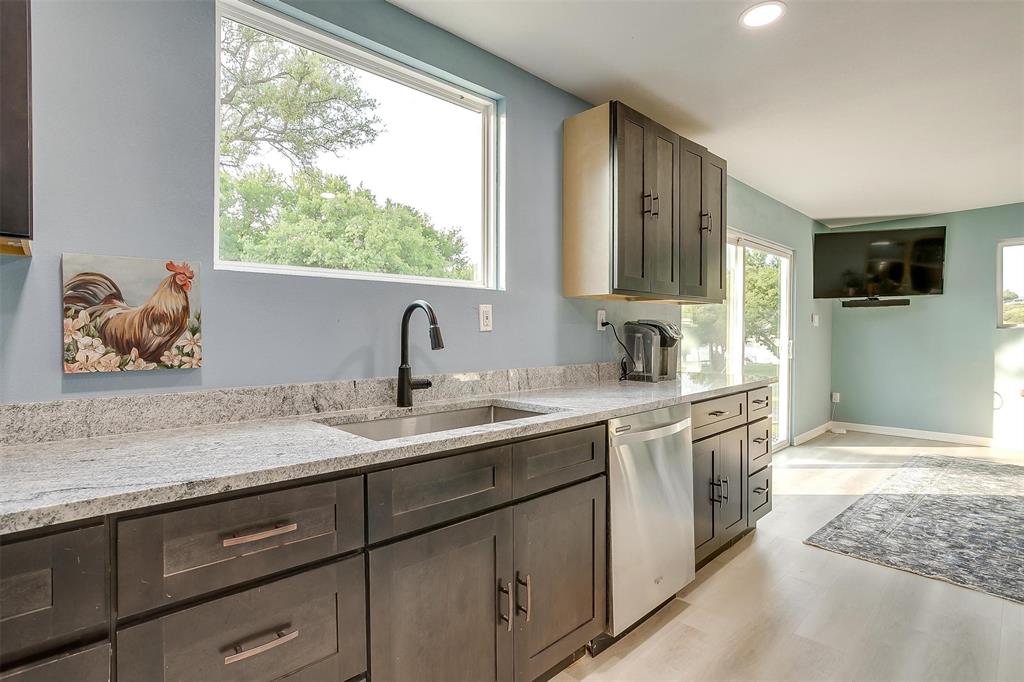 520 Deer Trail Gordon, TX 76453 - Photo 24 of 40 a spacious bathroom with a granite countertop sink and a window