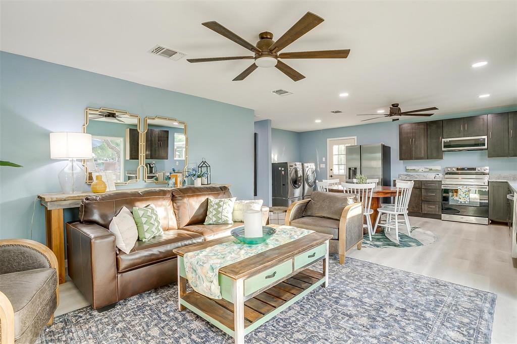 520 Deer Trail Gordon, TX 76453 - Photo 26 of 40 a living room with furniture kitchen view and a chandelier