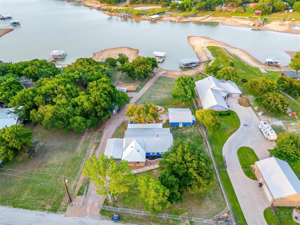 520 Deer Trail Gordon, TX 76453 - Photo 3 of 40 an aerial view of a house with a garden and lake view